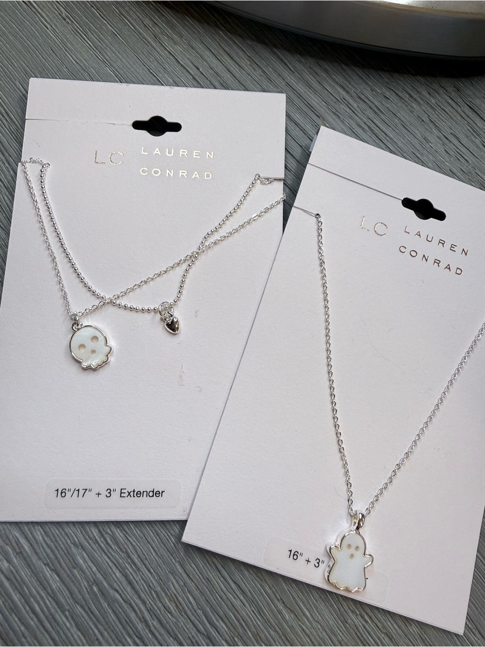 LC Lauren Conrad Silver & White Ghost Pendant Necklace  and Skull….    Set of 2